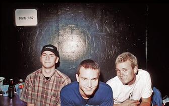 LOS ANGELES - OCTOBER 8:  Punk Rock band Blink 182  (L-R Travis Barker, Mark Hoppus, Tom DeLonge) pose for a portrait in their dressing room at the Whisky A Go Go in Los Angeles, California on October 8, 1996. (Photo by Jim Steinfeldt/Michael Ochs Archives/Getty Images) 