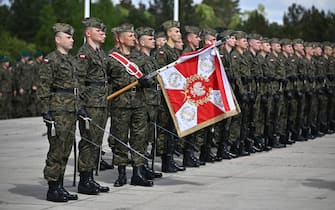 epa12083089 Polish soldiers take part in a solemn roll call on the occasion of the National Victory Day commemorating the end of WWII, on the grounds of the Gen. Tadeusz Kosciuszko Warsaw Armored Brigade in Warsaw - Wesola, Poland, 08 May 2025. World War II ended by the unconditional surrender of Nazi Germany on all fronts on 08 May 1945.  EPA/PRZEMYSLAW PIATKOWSKI POLAND OUT