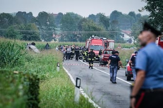 A plane of the acrobatic patrol of the Frecce Tricolori crashed near the airport of Caselle, Turin, Italy, 16 September 2023. The pilot escaped by parachuting while a five-year-old girl died in the crash. The aircraft crashed at the bottom of the track involving, according to the first news, a car.    ANSA / TINO ROMANO