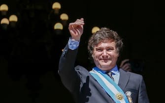 epa11022146 Argentina's President Javier Milei walks out onto the balcony of the Casa Rosada to greet supporters in Buenos Aires, Argentina, on 10 December 2023. Milei arrived at the Casa Rosada (seat of government) for the first time as head of state of the South American country, after taking the oath of office in Congress and delivering his speech to citizens. The leader of La Libertad Avanza (ultra-right) moved with his sister and main advisor, Karina Milei, in a convertible vehicle to the Plaza de Mayo, where, upon arriving at the Metropolitan Cathedral, he got out of the car and walked among the shouting of his followers.  EPA/Luciano Gonzalez