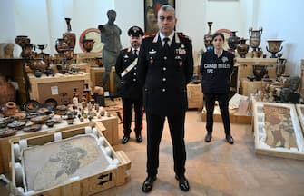 Italian Carabinieri General, Francesco Cargaro (C), poses for photographer during the presentation to journalists of some 600 stolen works of art that where gave back by the United States of America to the Italian Carabinieri Command for the Protection of Cultural Heritage, in Rome, Italy, 28 May 2024. ANSA/ETTORE FERRARI

