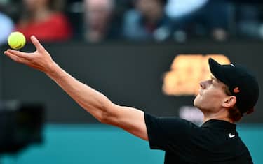 Italy's Jannik Sinner serves to Argentina's Mariano Navone during their men's singles match of the ATP Rome Open tennis tournament at Foro Italico in Rome on May 10, 2025. (Photo by Marco BERTORELLO / AFP)