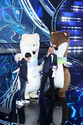 SANREMO, ITALY - FEBRUARY 07: The mascots of the Milan-Cortina 2026 Winter Olympics and Paralympics, Federico Barra and Amadeus attend the 74th Sanremo Music Festival 2024 at Teatro Ariston on February 07, 2024 in Sanremo, Italy. (Photo by Daniele Venturelli/Daniele Venturelli/Getty Images )