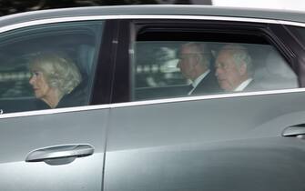 ABERDEEN, SCOTLAND - SEPTEMBER 09: King Charles III and Camilla, Queen Consort leave the Balmoral estate as they return to London following the death of Queen Elizabeth II, on September 9, 2022 in Aberdeen, United Kingdom. Elizabeth Alexandra Mary Windsor was born in Bruton Street, Mayfair, London on 21 April 1926. She married Prince Philip in 1947 and acceded the throne of the United Kingdom and Commonwealth on 6 February 1952 after the death of her Father, King George VI. Queen Elizabeth II died at Balmoral Castle in Scotland on September 8, 2022, and is succeeded by her eldest son, King Charles III. (Photo by Jeff J Mitchell/Getty Images)