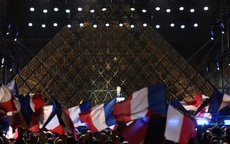 TOPSHOT - French president-elect Emmanuel Macron delivers a speech in front of the Pyramid at the Louvre Museum in Paris on May 7, 2017, after the second round of the French presidential election.
Emmanuel Macron was elected French president on May 7, 2017 in a resounding victory over far-right Front National (FN - National Front) rival after a deeply divisive campaign. / AFP PHOTO / Eric FEFERBERG        (Photo credit should read ERIC FEFERBERG/AFP via Getty Images)