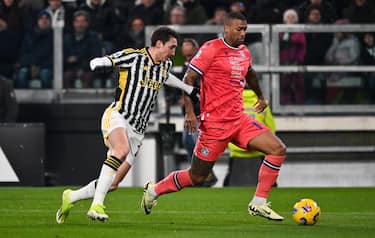 TURIN, ITALY - FEBRUARY 12: (L-R) Andrea Cambiaso of Juventus FC against Walace of Udinese Calcio during the Serie A TIM match between Juventus and Udinese Calcio - Serie A TIM  at  on February 12, 2024 in Turin, Italy. (Photo by Stefano Guidi/Getty Images)