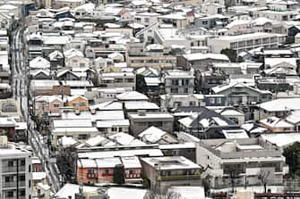 This general view shows snow-covered roofs across a neighbourhood in central Tokyo on February 6, 2024, after the Japanese capital received snow the night before. (Photo by Richard A. Brooks / AFP) (Photo by RICHARD A. BROOKS/AFP via Getty Images)
