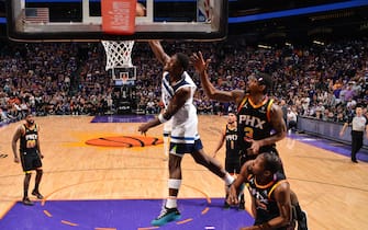 PHOENIX, AZ - APRIL 4: Anthony Edwards #5 of the Minnesota Timberwolves dunks the ball during the game against the Phoenix Suns during Round 1 Game 4 of the 2024 NBA Playoffs on April 4, 2023 at Footprint Center in Phoenix, Arizona. NOTE TO USER: User expressly acknowledges and agrees that, by downloading and or using this photograph, user is consenting to the terms and conditions of the Getty Images License Agreement. Mandatory Copyright Notice: Copyright 2024 NBAE (Photo by Barry Gossage/NBAE via Getty Images)