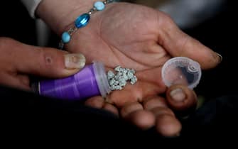 VANCOUVER, BRITISH COLUMBIA - MAY 03: A man shows an eight ball, or 3.5 grams, of fentanyl along East Hastings Street in the Downtown Eastside (DTES) neighborhood on Tuesday, May 3, 2022 in Vancouver, British Columbia. High levels of drug use, homelessness, poverty, crime, mental illness and sex work is prolific along East Hastings Street. Supervised consumption sites in the DTES give addicts who use fentanyl, opioids, crystal methamphetamine and other drugs a place to use and get harm reduction supplies; clean syringes, alcohol swabs, sterile water, tourniquets, spoons and filters. On April 14, 2016, provincial health officer Dr. Perry Kendall declared a public health emergency under the Public Health Act due to the significant rise in opioid-related overdose deaths reported in B.C. since the beginning of 2016. (Gary Coronado / Los Angeles Times via Getty Images)