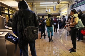 NEW YORK, NEW YORK - SEPTEMBER 29: People stand around at the Church Avenue subway station as subway service is stopped amid heavy rain on September 29, 2023 in the Flatbush neighborhood of Brooklyn borough New York City. Flash flooding is expected in the counties of Nassau, Queens and Kings, which includes Brooklyn, according to the stateâ  s National Weather Service office as remnants of Tropical Storm Ophelia reaches the Northeast.  (Photo by Michael M. Santiago/Getty Images)