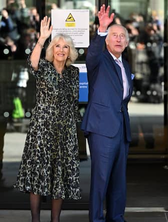 LONDON, ENGLAND - APRIL 30: King Charles III And Queen Camilla wave at well wishers during there visit to the University College Hospital Macmillan Cancer Centre on April 30, 2024 in London, England. (Photo by Samir Hussein/WireImage)