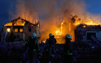epa11330778 Ukrainian rescuers work to extinguish a fire at the site of an overnight missile strike on private buildings in Kharkiv, northeastern Ukraine, 10 May 2024, amid the Russian invasion. Kharkiv was hit by an S-300 missile at night, Mayor Ihor Terekhov wrote on telegram. At least two people, a 11-year-old child and a 72-year-old woman, were injured in the attack, according to the head of the Kharkiv Regional Military Administration, Oleg Synegubov. Russian troops entered Ukrainian territory on 24 February 2022, starting a conflict that has provoked destruction and a humanitarian crisis.  EPA/SERGEY KOZLOV