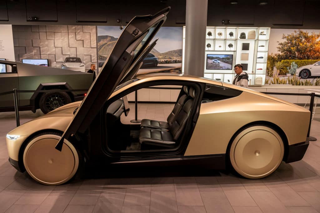 Robotaxi Tesla A Tesla Cybercab prototype at a Tesla store in San Jose, California, US, on Tuesday, Nov. 12, 2024. Tesla CEO Elon Musk said the robotaxi, which has no steering wheel or pedals, could cost less than $30,000 and "probably" will go into production in 2026. Photographer: David Paul Morris/Bloomberg via Getty Images
