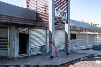 A damaged Posts and Telecommunications office is seen following unrest in the Magenta district of Noumea, France's Pacific territory of New Caledonia, on May 18, 2024. Hundreds of French security personnel tried to restore order in the Pacific island territory of New Caledonia on May 18, after a fifth night of riots, looting and unrest. (Photo by Delphine Mayeur / AFP) (Photo by DELPHINE MAYEUR/AFP via Getty Images)