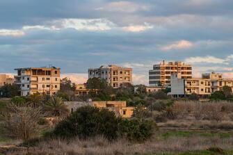 FAMAGUSTA, CYPRUS - JANUARY 05:  Nature covers the abandoned houses of the Varosha quarter on January 5, 2017 in Famagusta, Cyprus. Prior to the Turkish invasion of Cyprus in 1974, the abandoned quarter of Varosha was the modern tourist area of the city, and one of the most important tourist destinations in the world.  (Photo by Awakening/Getty Images)