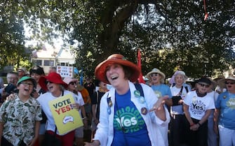 SYDNEY, AUSTRALIA - SEPTEMBER 17: Members of a choir sing as they arrive at Redfern Park ahead of a 'Walk for YES' event on September 17, 2023 in Sydney, Australia. On October 14, 2023, Australians will vote on a referendum to amend the Constitution to recognise First Peoples of Australia and establish an Aboriginal and Torres Strait Islander Voice to Parliament. To pass, the referendum requires a 'double majority'â   a national majority of  'yes' votes, and a majority of states voting 'yes'. (Photo by Lisa Maree Williams/Getty Images)