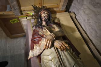A picture shows a wooden statue of Jesus that was pulled down and damaged in the Church of the Condemnation, where Christians believe Jesus was flogged and sentenced to death, in Jerusalem's Old City on February 2, 2023. - Israeli police said officers arrested an American man today over vandalising the church along a major pilgrimage route in Jerusalem's Old City. "The suspect arrested is an American tourist in his forties, who vandalised and broke a statue in the church," said a statement from the Israeli police, adding that the man's mental health was being assessed. A spokeswoman for the United States embassy in Jerusalem did not comment on the incident when contacted by AFP. (Photo by AHMAD GHARABLI / AFP) (Photo by AHMAD GHARABLI/AFP via Getty Images)