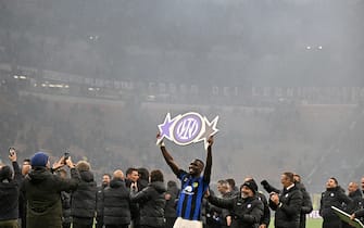 Inter Milan's French forward #09 Marcus Thuram celebrates winning the 2024 Scudetto championship title on April 22, 2024, following the Italian Serie A football match between AC Milan and Inter Milan at the San Siro Stadium in Milan. (Photo by GABRIEL BOUYS / AFP) (Photo by GABRIEL BOUYS/AFP via Getty Images)