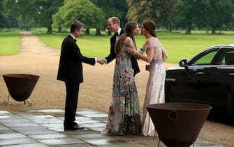 The Duke and Duchess of Cambridge are greeted by the Marquess and Marchioness of Cholmondeley (at left) as they attend a gala dinner at Houghton Hall in King's Lynn in support of East Anglia's Children's Hospices' nook appeal, which is raising funds to build and equip a new children's hospice for families in Norfolk.
