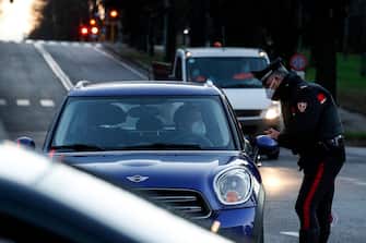 Italian Carabinieri officers check vehicles in EUR district during a complete lockdown for new year holidays as part of efforts put in place to curb the spread of the coronavirus disease, in Rome, Italy, 31 December 2020, ANSA/GIUSEPPE LAMI