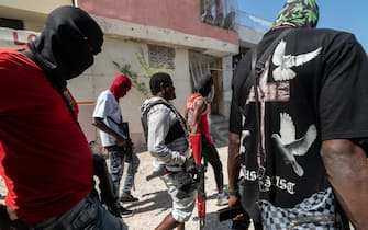 Jimmy "Barbecue" Chérizier (center) is a Haitian gang leader and a former police officer who is the head of the G9 gang federation which consists of over a dozen Haitian gangs based in Port au Prince. Chérizier is currently considered the most powerful gang leader in Haiti today.