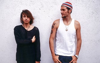"Italian songwriters Gianna Nannini and Jovanotti pose together against a white wall; the two artists have recently collaborated to the song ""Radio Baccano"" in Nannini's album ""X forza e X amore"" on May 1993 in Italy.  (Photo by Angelo Deligio\Mondadori via Getty Images)"
