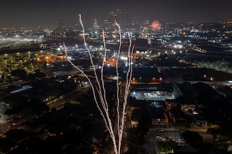 LOS ANGELES, CA - JULY 04: In an aerial view, large illegal fireworks are set off late into the night, long after the professional Independence Day shows have ended, on July 4, 2022 in Los Angeles, California. Though local fireworks complaints to police have reportedly decreased by about half this year, and by more than 80 percent since 2022, large sections of Los Angeles are home to people who come from cultures where personal fireworks are embraced. Those aerial explosives have grown bigger with time.  (Photo by David McNew/Getty Images)