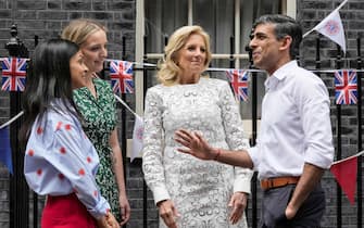 Britain's Prime Minister Rishi Sunak (R), his wife Akshata Murty (L) speak with US First Lady Jill Biden (2nd R) and her grand daughter Finnegan Biden during a Coronation Big Lunch organised in Downing Street, in London, on May 7, 2023. - Thousands of local street parties were planned on May 7, 2023 on the second day of events to mark the coronation of King Charles III, ending with a concert in front of 20,000 people at Windsor Castle. (Photo by Frank Augstein / POOL / AFP) (Photo by FRANK AUGSTEIN/POOL/AFP via Getty Images)