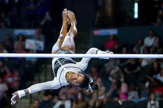 epa10786893 US artistic gymnast Simone Biles competes on the uneven bars during the Core Hydration Classic at the NOW Arena in Hoffman Estates, Illinois, USA, 05 August 2023. Biles is returning to competition after a two-year break after the Tokyo 2020 Olympics.  EPA/ALEX WROBLEWSKI