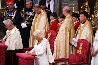 LONDON, ENGLAND - MAY 06: Prince George (C) watches King Charles III and Queen Camilla during their coronation ceremony in Westminster Abbey on May 6, 2023 in London, England. The Coronation of Charles III and his wife, Camilla, as King and Queen of the United Kingdom of Great Britain and Northern Ireland, and the other Commonwealth realms takes place at Westminster Abbey today. Charles acceded to the throne on 8 September 2022, upon the death of his mother, Elizabeth II. (Photo by Yui Mok  - WPA Pool/Getty Images)