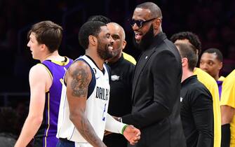 LOS ANGELES, CA -MARCH 17: LeBron James #6 of the Los Angeles Lakers talks with Kyrie Irving #2 of the Dallas Mavericks after the game against the Dallas Mavericks on March 17, 2023 at Crypto.Com Arena in Los Angeles, California. NOTE TO USER: User expressly acknowledges and agrees that, by downloading and/or using this Photograph, user is consenting to the terms and conditions of the Getty Images License Agreement. Mandatory Copyright Notice: Copyright 2023 NBAE (Photo by Adam Pantozzi/NBAE via Getty Images)