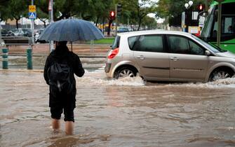 epa11693647 Vehicles drive through flood water following heavy rainfalls in Castellon de la Plana, Valencia, Spain, 31 October 2024. At least 95 people died in the province of Valencia and neighboring provinces following floods caused by the DANA (high-altitude isolated depression) phenomenon impacting the eastern part of the country.  EPA/ANDREU ESTEBAN