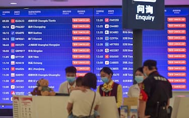 A screen shows cancelled flights at Haikou Meilan International Airport as a precaution for the approaching Typhoon Talim, in China's southern Hainan province on July 17, 2023. (Photo by CNS / AFP) / China OUT (Photo by -/CNS/AFP via Getty Images)