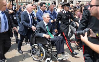 MILAN, ITALY - JUNE 14: Former leader and founder of far-right party League (Lega) Umberto Bossi and his son Renzo Bossi arrive at the Duomo cathedral in Milan ahead of the state funeral for Italy's former prime minister and media tycoon Silvio Berlusconi on June 14, 2023 in Milan, Italy. Silvio Berlusconi, the former Italian Prime Minister who bounced back from a series of scandals, died on June 12, 2023 at age 86. His state funeral takes place on June 14, and a national day of mourning has been announced. The politician and businessman, at the time of his death, has the third largest fortune in Italy. According to media estimates, his net worth was between 6 and 7 billion dollars. (Photo by Ernesto Ruscio/Getty Images)