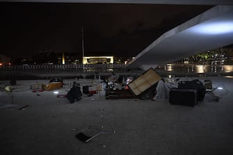 BRASILIA, BRAZIL - JANUARY 8: Damaged furniture are seen piled in front of the Palacio do Planalto (the official workplace of the president of Brazil) following a protest by supporters of Brazil's former President Jair Bolsonaro against President Luiz Inacio Lula da Silva, in Brasilia, Brazil, on January 8, 2023. (Photo by Mateus Bonomi/Anadolu Agency via Getty Images)