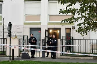 epa11044461 French police stand in front of a building where five bodies were found dead in Meaux, near Paris, France, 26 December 2023. Five bodies, of a mother and her four children were found dead by French police in an apartment on the evening of 25 December. Jean-Baptiste Bladier, the local prosecutor confirmed that a homicide investigation has been launched after the five bodies were found.  EPA/Christophe Petit Tesson