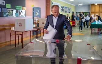 Poland's Prime Minister Donald Tusk casts his vote for European Parliament Elections at a polling station in Warsaw, Poland, on June 9, 2024. (Photo by Wojtek Radwanski / AFP)