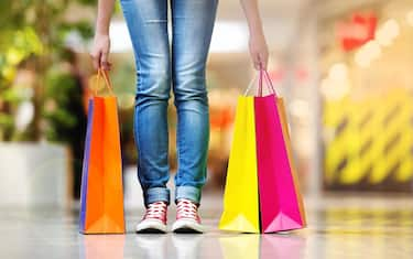 Shopping time, young teenage girl with shopping bags at shopping mall