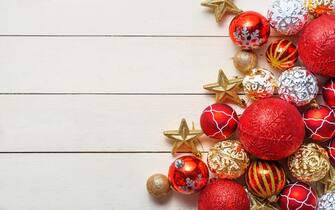 Christmas background with decorations on wooden background. Top view with copy space