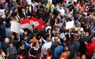 epa12067053 Members of the Tunisian General Labour Union (UGTT) attend a demonstration to mark the International Workers' Day in Tunis, Tunisia, 01 May 2025. Labor Day, or May Day, is observed worldwide on 01 May to celebrate the economic and social achievements of workers as well as fight for laborers' rights.  EPA/MOHAMED MESSARA