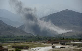 In this photograph taken on April 11, 2017, smoke rises after an air strike by US aircraft on positions during an ongoing an operation against Islamic State (IS) militants in the Achin district of Afghanistan's Nangarhar province.
An American special forces soldier has been killed while conducting operations against the Islamic State group in Afghanistan, the US military said. The US-backed Afghan military has vowed to wipe out the group in its strongholds in the eastern province of Nangarhar as IS challenges the more powerful Taliban on its own turf. / AFP PHOTO / NOORULLAH SHIRZADA        (Photo credit should read NOORULLAH SHIRZADA/AFP via Getty Images)