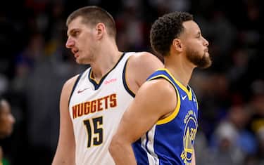 DENVER, CO - DECEMBER 25: Nikola Jokic (15) of the Denver Nuggets and Stephen Curry (30) of the Golden State Warriors lead their teams during the second quarter at Ball Arena in Denver on Monday, December 25, 2023. (Photo by AAron Ontiveroz/The Denver Post)