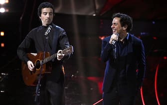 Italian singer Diodato (L) with British singer Jack Savoretti perform on stage at the Ariston theatre during the 74th Sanremo Italian Song Festival, Sanremo, Italy, 09 February 2024. The music festival will run from 06 to 10 February 2024. ANSA/RICCARDO ANTIMIANI