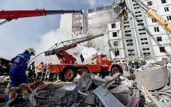 epa10595928 Rescuers work at the site of a damaged residential building after a missile attack, in Uman, Cherkasy region, central Ukraine, 28 April 2023, amid Russia's invasion. At least six people were killed as a result of a rocket attack in Uman, and nine others injured, the Head of the Cherkasy Regional Military Administration, Ihor Taburets wrote on telegram. Ukraine's Ministry of Internal Affairs said on 28 April, that the Russian army conducted attacks on residential buildings across the country, including Dnipro, Uman and Ukrainka in the Kyiv region. Russian troops entered Ukrainian territory in February 2022, starting a conflict that has provoked destruction and a humanitarian crisis.  EPA/OLEG PETRASYUK