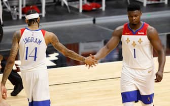 MIAMI, FLORIDA - DECEMBER 25: Brandon Ingram #14 and Zion Williamson #1 of the New Orleans Pelicans high five against the Miami Heat during the third quarter at American Airlines Arena on December 25, 2020 in Miami, Florida. NOTE TO USER: User expressly acknowledges and agrees that, by downloading and or using this photograph, User is consenting to the terms and conditions of the Getty Images License Agreement.  (Photo by Michael Reaves/Getty Images)