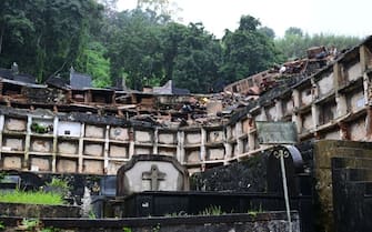 Partial view of the municipal cemetery of Petropolis, where several niches were damaged when they collapsed due to the heavy rains in Petropolis, Brazil on March 2024. At least nine people died in the midst of a strong storm that hits the southeast of Brazil, particularly the mountain area of the state of Rio de Janeiro, where authorities deployed a strong operation this Saturday in the face of a "critical" situation. The authorities reported three deaths in the collapse of a house in the city of Petropolis, about 70 kilometers from the capital of Rio, in a bulletin issued by an emergency committee formed by the government of Rio together with the Fire and Defense forces. (Photo by Pablo PORCIUNCULA / AFP) (Photo by PABLO PORCIUNCULA/AFP via Getty Images)
