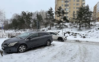 STOCKHOLM, SWEDEN - JANUARY 03: A car moves on the snow covered road during the frosty weather in Stockholm, Sweden on January 03, 2024. Today was recorded as 'the coldest day in January in Sweden in the last 25 years' while temperatures in the Scandinavian region fell below minus 40 degrees centigrade for two consecutive days. (Photo by Atila Altuntas/Anadolu via Getty Images)