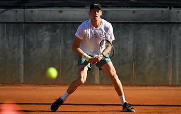 Italy's Jannik Sinner eyes the ball as he plays against US Taylor Fritz during a training session ahead of the ATP Rome Open tennis tournament at Foro Italico in Rome, on May 7, 2025. (Photo by PIERO CRUCIATTI / AFP) (Photo by PIERO CRUCIATTI/AFP via Getty Images)          