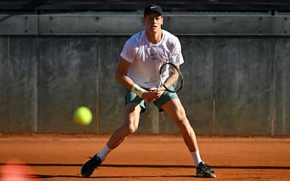 Italy's Jannik Sinner eyes the ball as he plays against US Taylor Fritz during a training session ahead of the ATP Rome Open tennis tournament at Foro Italico in Rome, on May 7, 2025. (Photo by PIERO CRUCIATTI / AFP) (Photo by PIERO CRUCIATTI/AFP via Getty Images)          