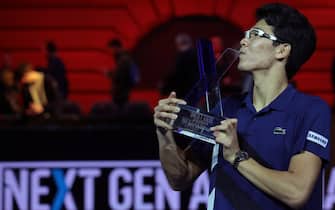 MILAN, ITALY - NOVEMBER 11:  Hyeon Chung of South Korea celebrates with the trophy after victory against Andrey Rublev of Russia in the mens final on day 5 of the Next Gen ATP Finals on November 11, 2017 in Milan, Italy.  (Photo by Emilio Andreoli/Getty Images)
